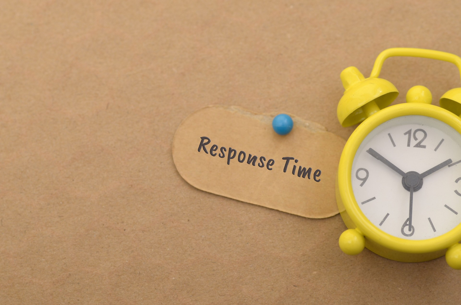 The image of an alarm clock and a note labeled Response Time emphasizes the importance of timely communication and efficient customer service.